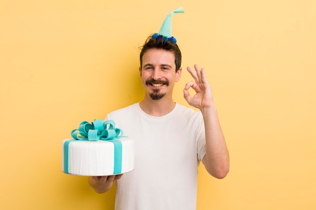 Young man with a birthday cake