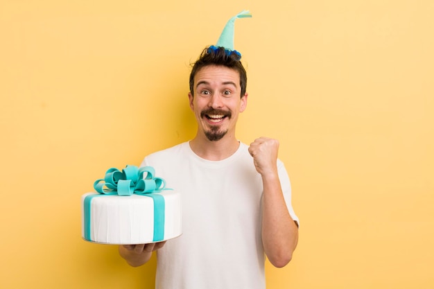 Young man with a birthday cake