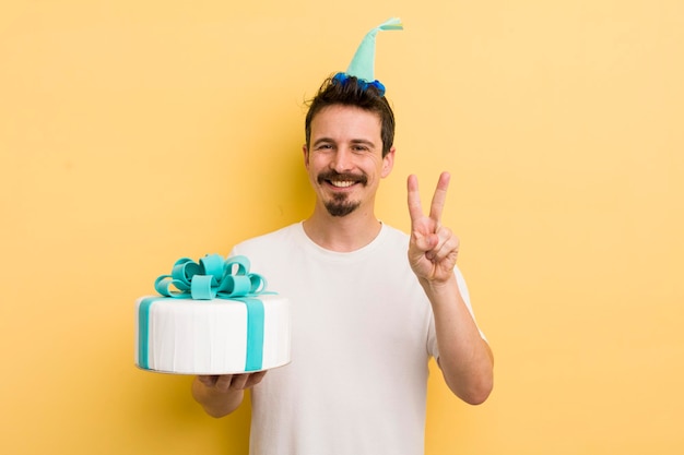 Young man with a birthday cake