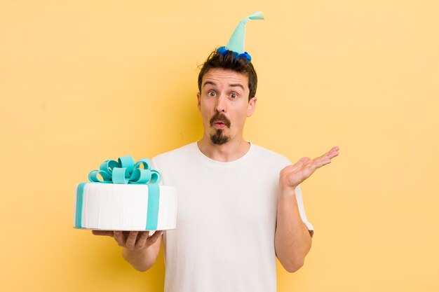 Young man with a birthday cake