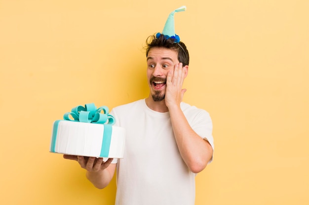 Young man with a birthday cake