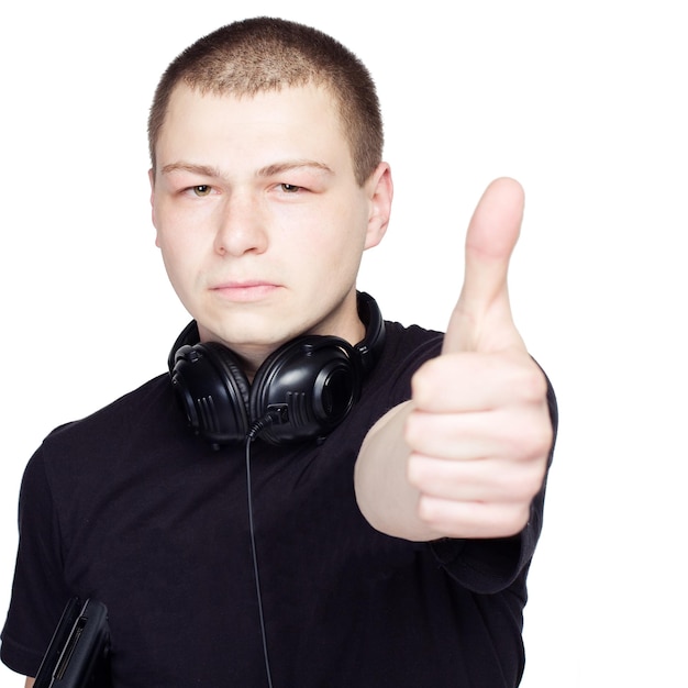 Young Man with black headphones showing Thumb Up