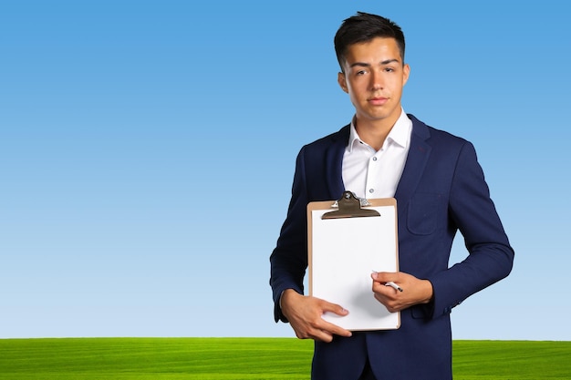 Young man with blank clipboard