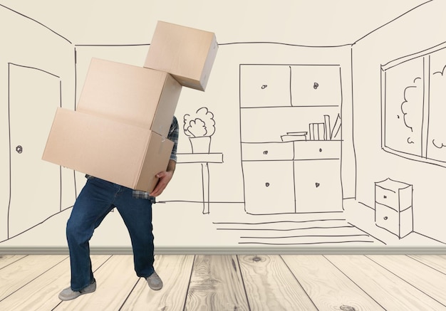 Young man with boxes at room