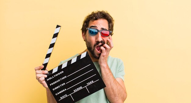 Young man with a clapper