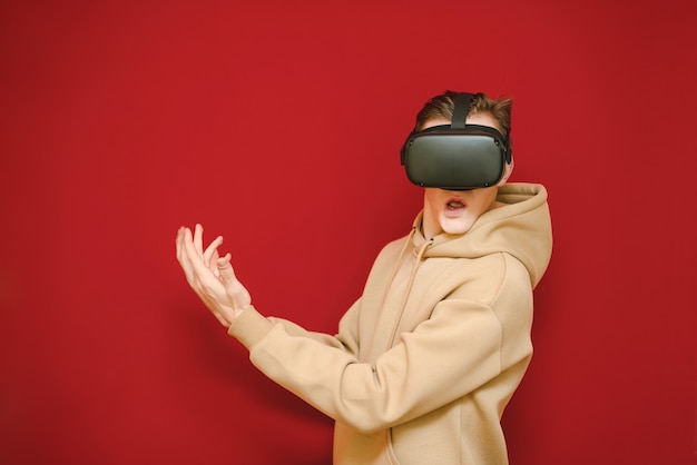 Young man with controller and VR helmets