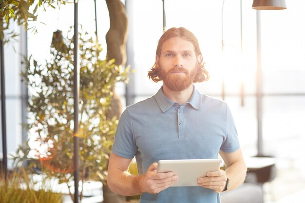 Young man with digital tablet