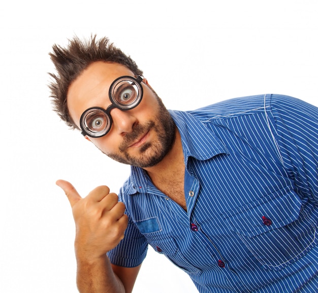 Young man with expression of OK and thick glasses