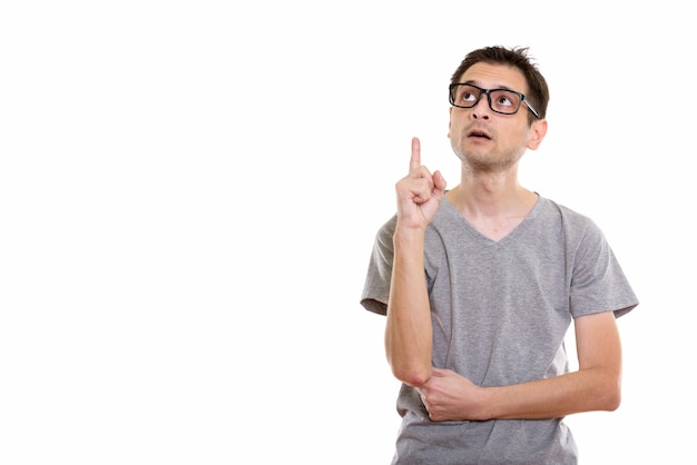 young man with eyeglasses thinking while pointing