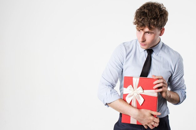 Young man with gifts in hands