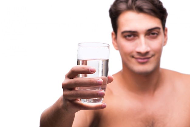 Young man with glass of water