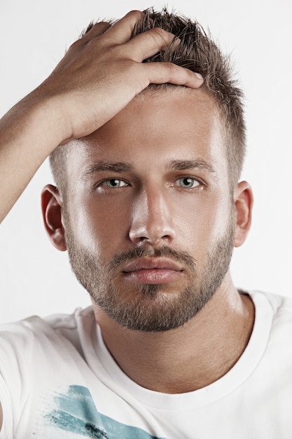 young man with hand in hair portrait