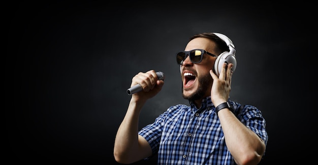 Photo young man with headphones. mixed media