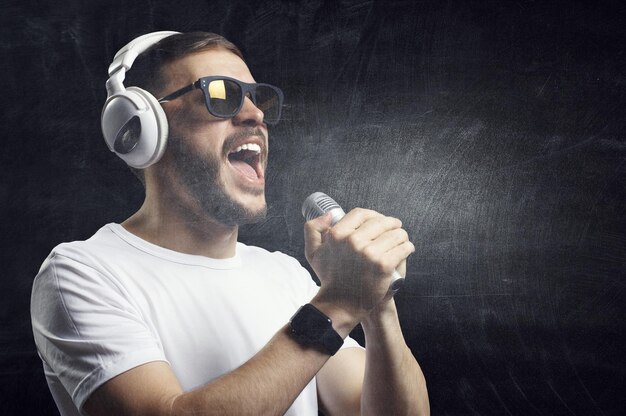 Photo young man with headphones. mixed media