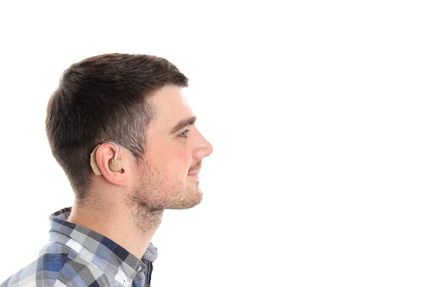 Young man with hearing aid isolated on white background