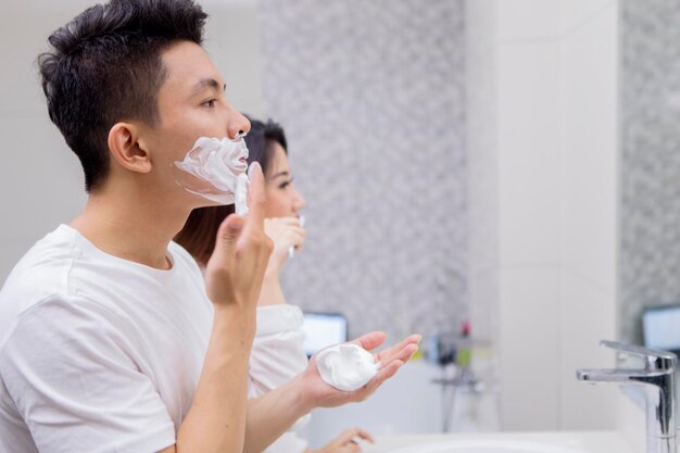 Young man with his wife in the bathroom