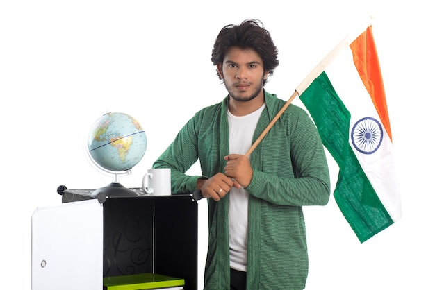 Photo young man with indian flag or tricolor with world globe on white background