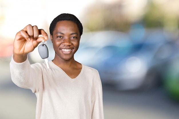 Young man with the keys standing