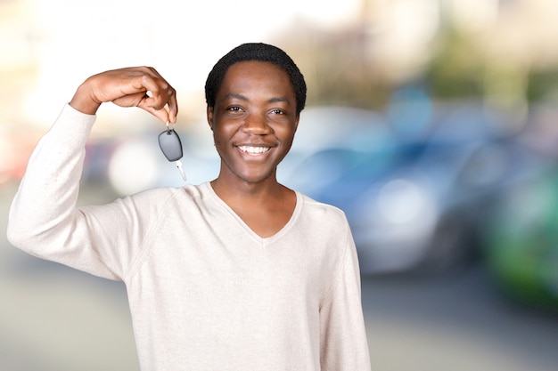 Young man with the keys standing