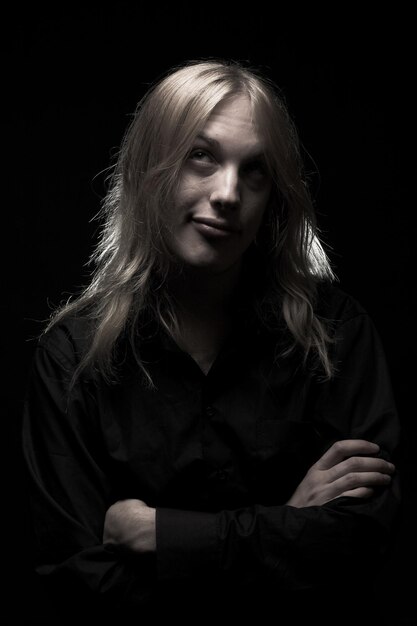 Young man with long blond hair