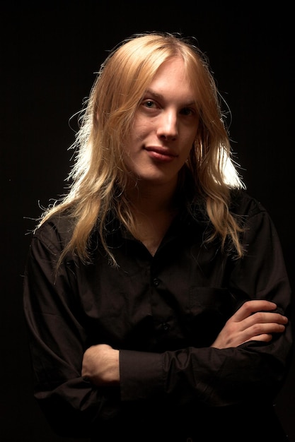 Young man with long blond hair