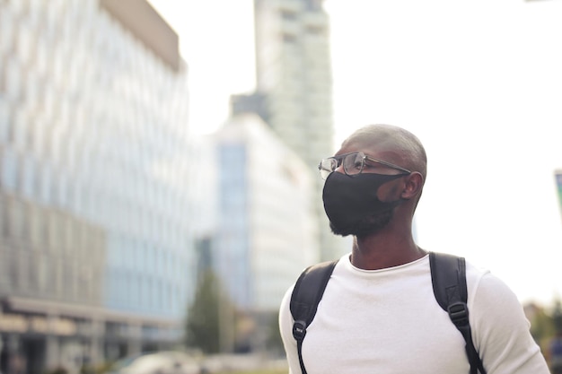 Young man with mask on the street