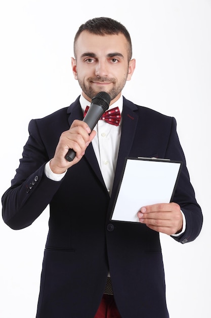 Young man with a microphone and a tablet