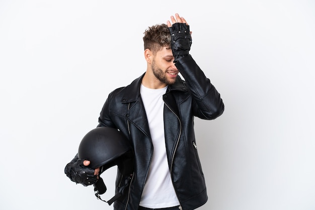 Young man with a motorcycle helmet isolated on white background has realized something and intending the solution