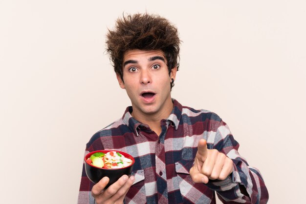 Photo young man with noodles