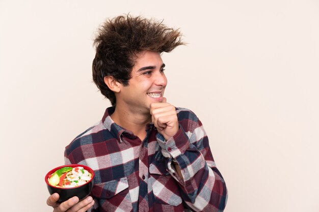 Young man with noodles