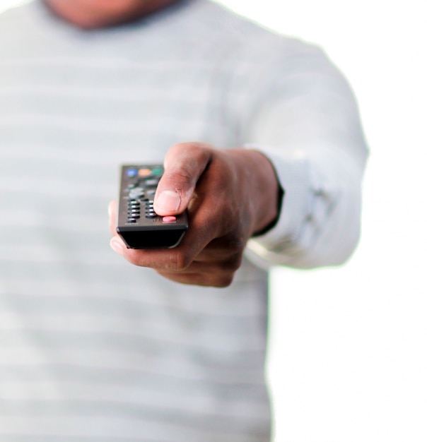 Photo young man with a remote control