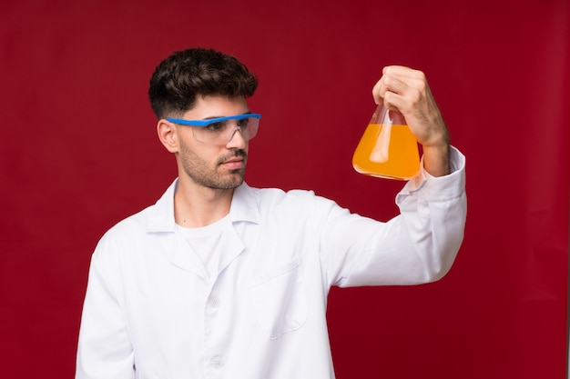 Young man with a scientific test tube