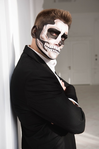 Young man with skull make up