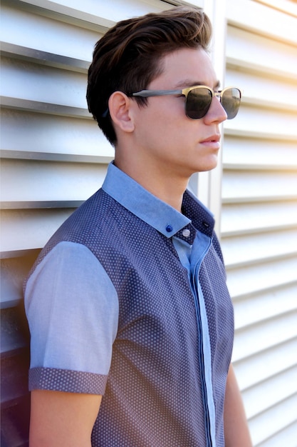 young man with sunglasses looking in profile