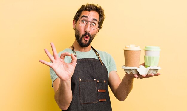 Young man with take away coffee