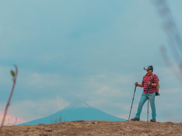 Young man with VR headset exploring nature