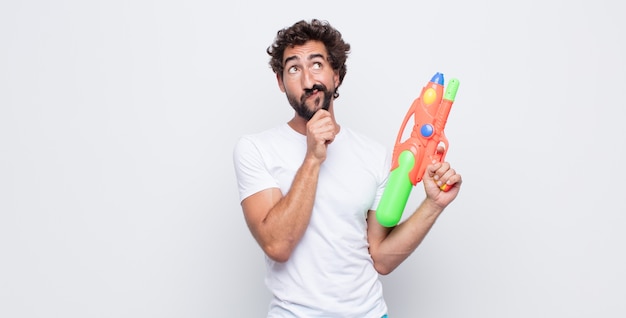 Young man with a water gun