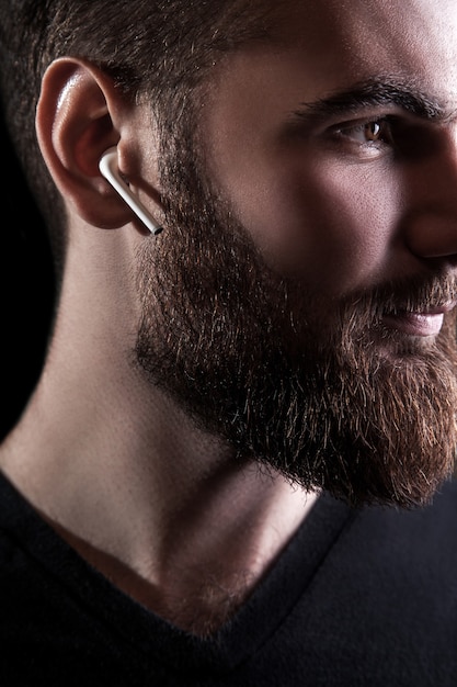Young man with wireless earphone