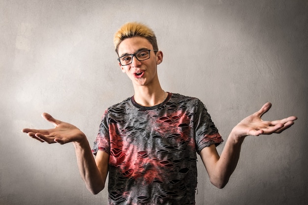 Young man with yellow hair and open arms