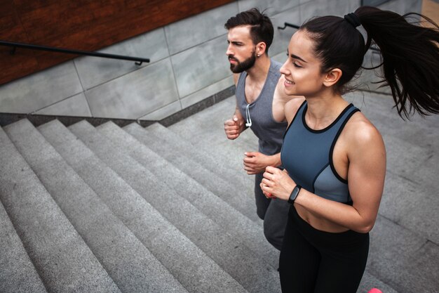 Young man and woman are jogging