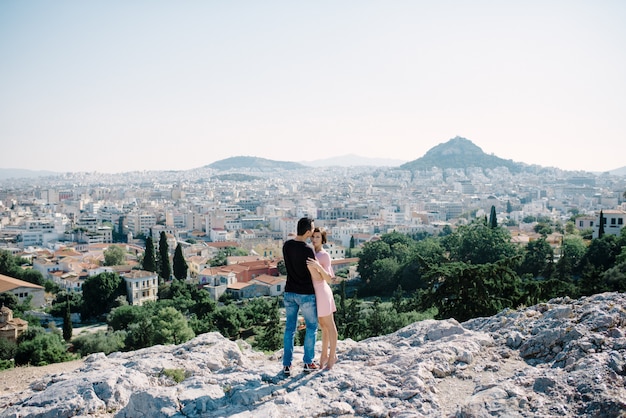 Young man and woman in love outdoors on the roof Love and relations concept