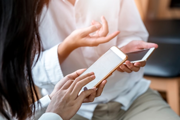 Young man and woman using smartphone connection