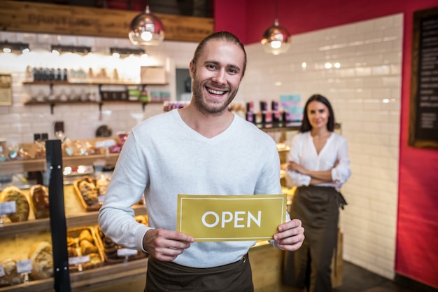 Young man and woman working in a bakery