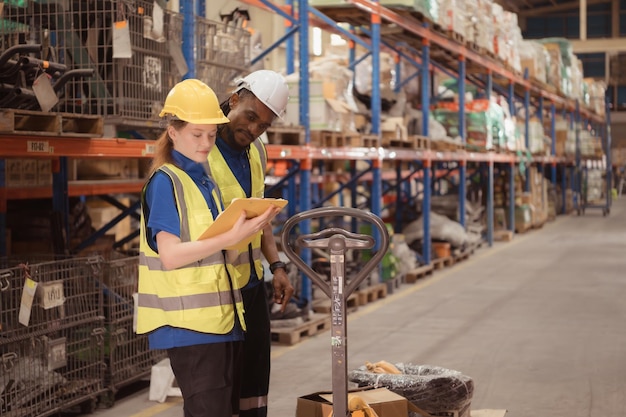 Young man and woman working together in warehouse This is a freight transportation