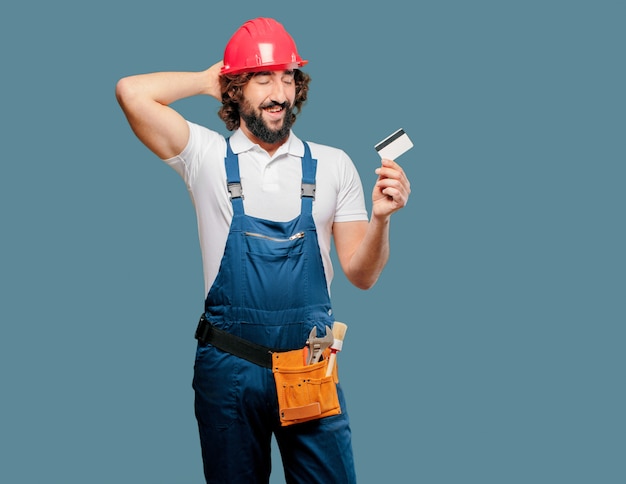 Young man worker with a credit card