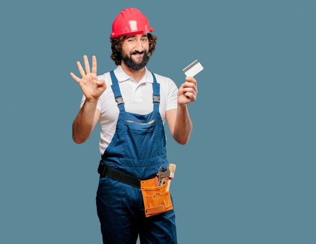 Young man worker with a credit card