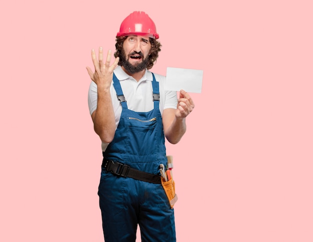 Young man worker with a placard