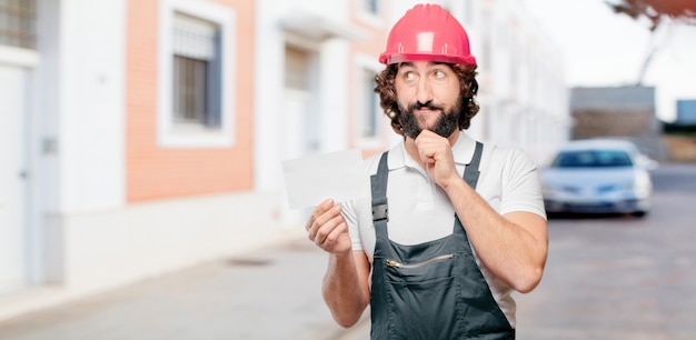 Young man worker with a placard