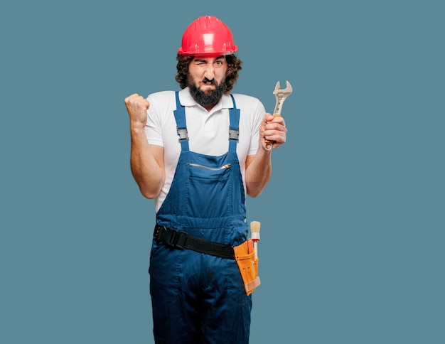 Young man worker with a wrench