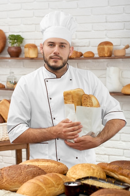 Young man working at his bakery